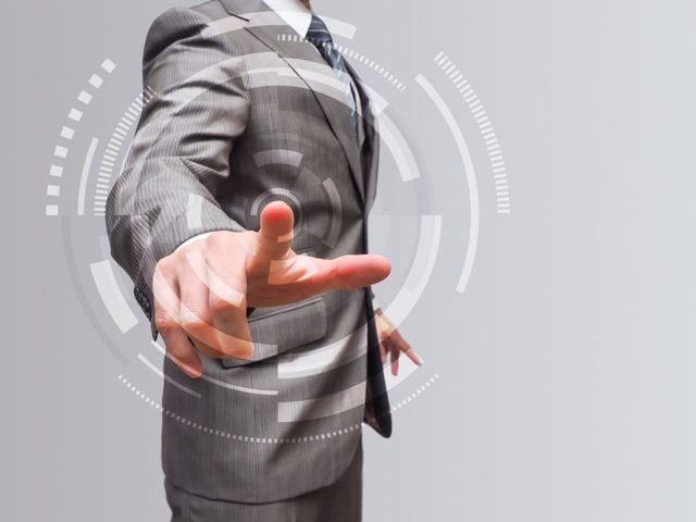 ポイントをさすビジネスマン